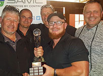 From left: Johan Maritz presents the trophy to Golf Day winners Michael Barnard, Nickey Minnaar, Harry Geel and Griff Smith from Team WIKA.
